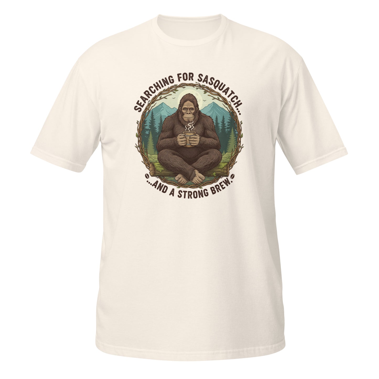 Funny T-Shirt in cream featuring Bigfoot graphic and 'Searching for Sasquatch' text on the front