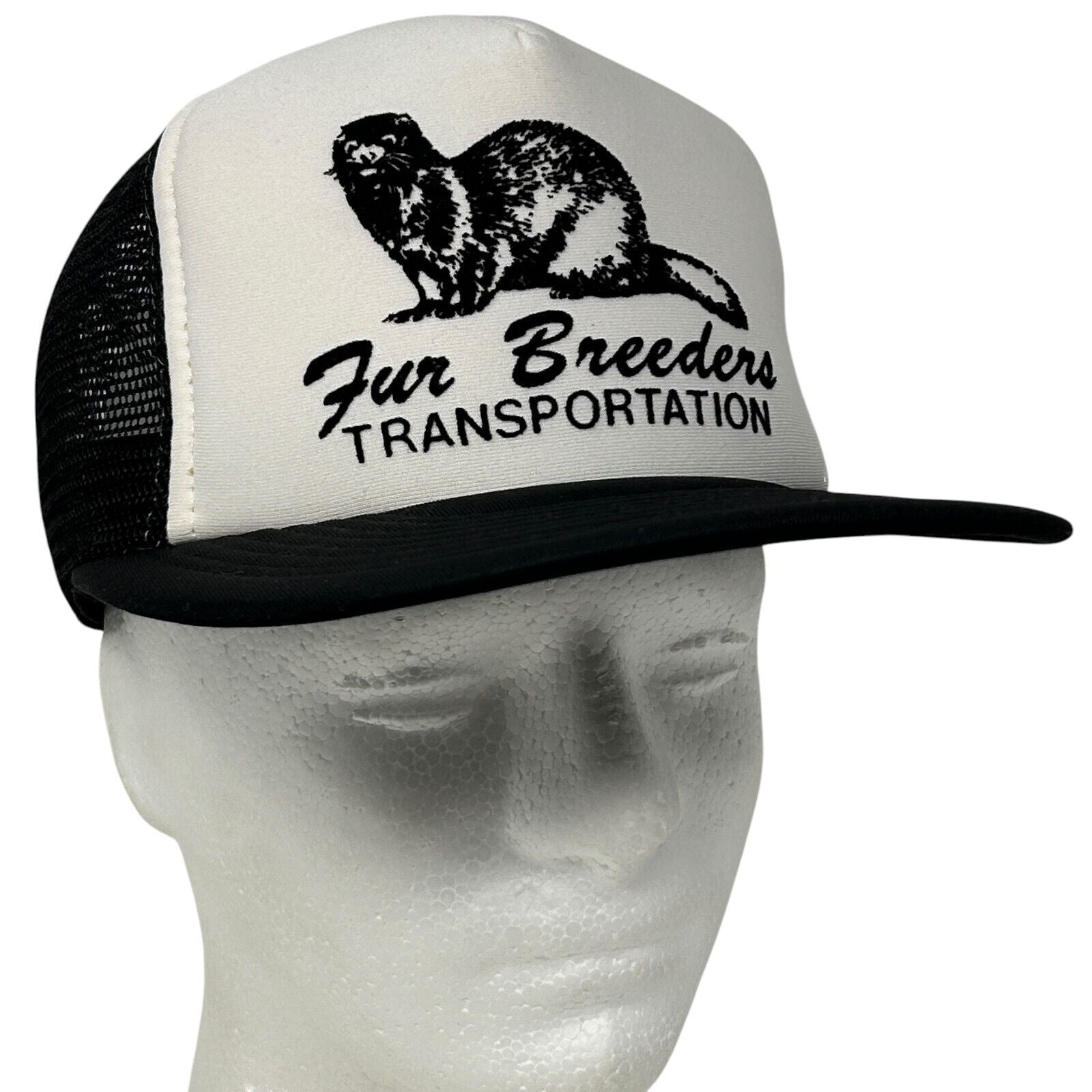 Vintage black and white trucker hat with 'Fur Breeders' logo on front and mesh back for breathable comfort