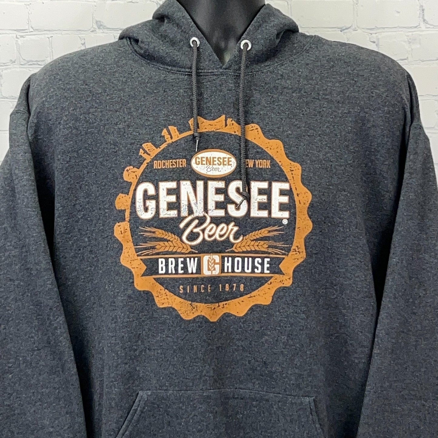Charcoal Jerzees hoodie with Genesee Brewing logo on front, featuring orange circular design and text.