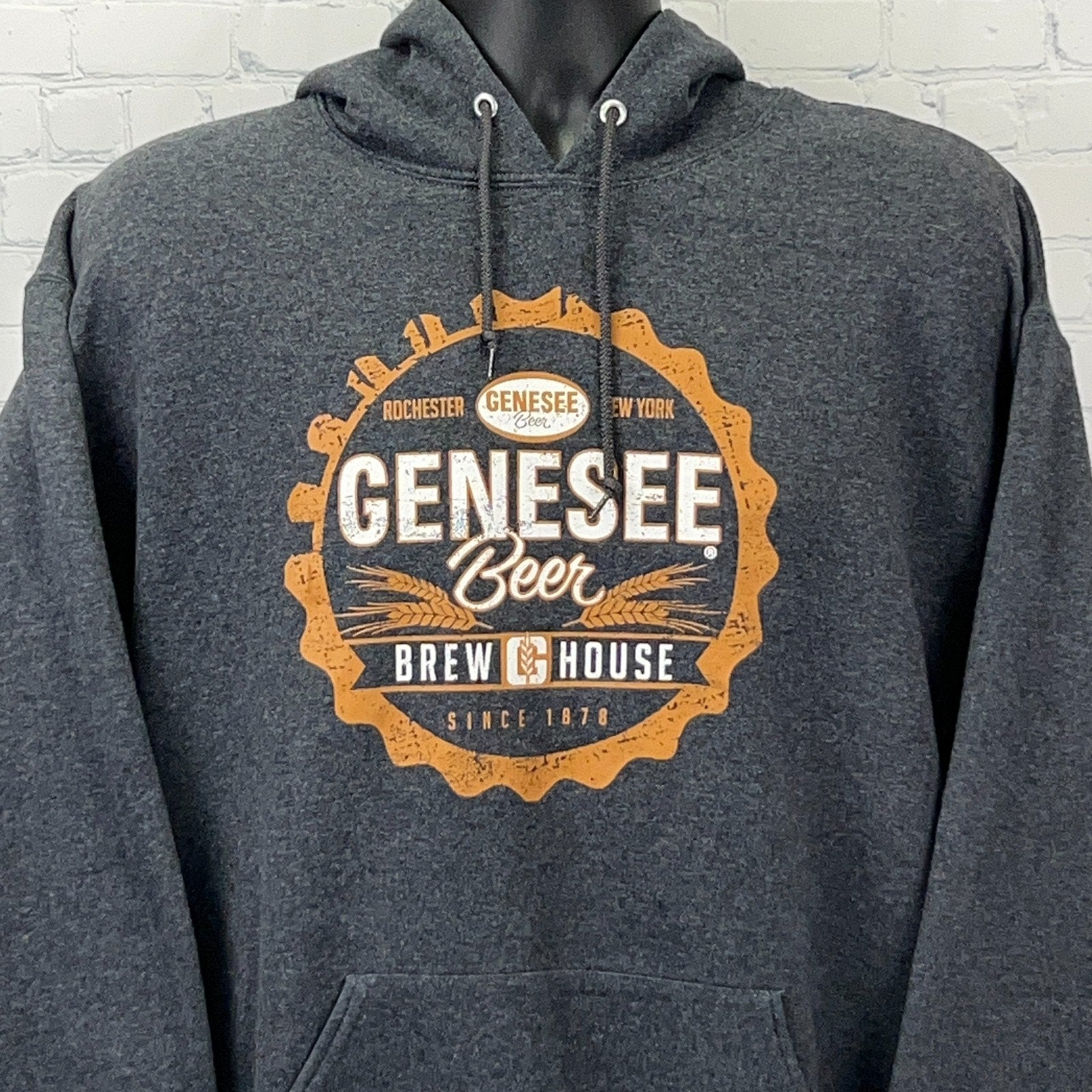 Charcoal Jerzees hoodie with Genesee Brewing logo on front, featuring orange circular design and text.