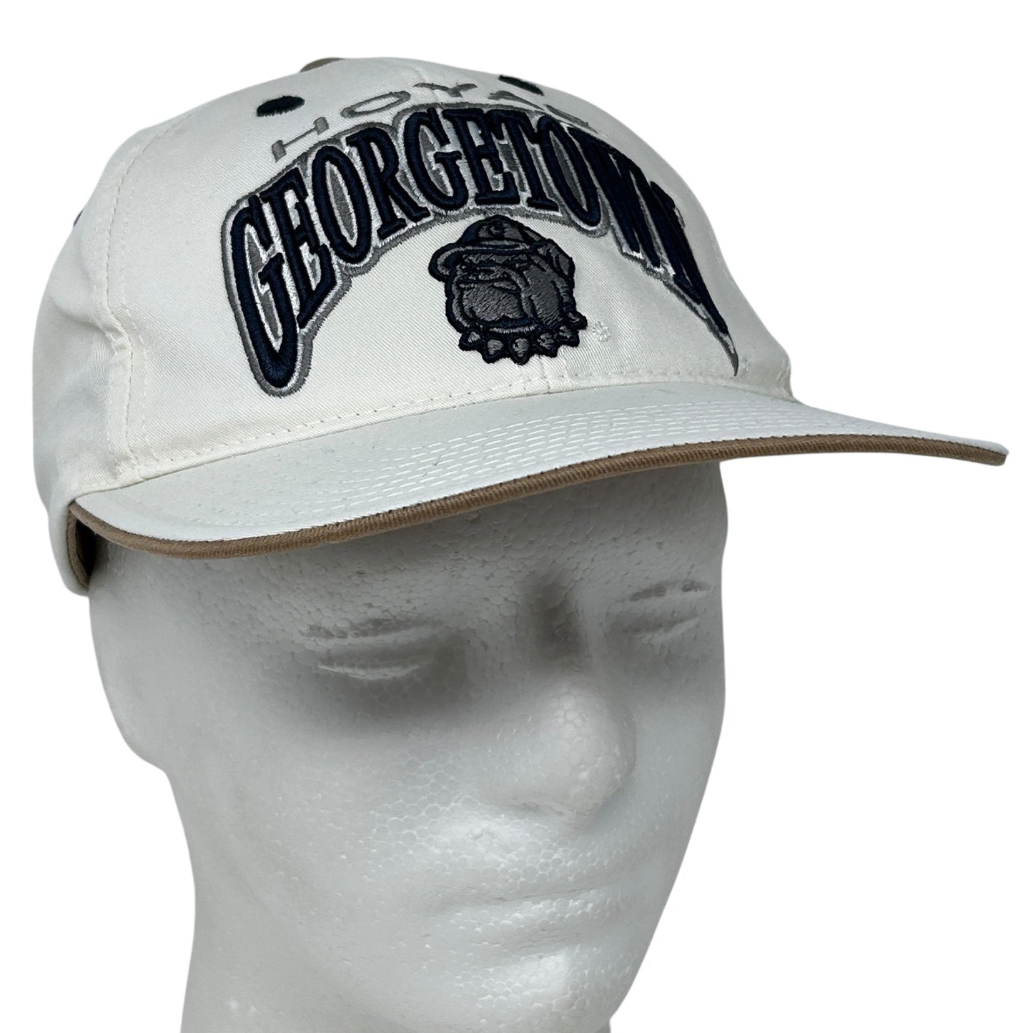 Front view of Georgetown University Hoyas cap in white with embroidered logo and text