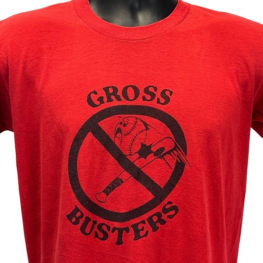 Vintage red T-shirt with 'Gross Busters' graphic on the front featuring a bird in a no symbol design