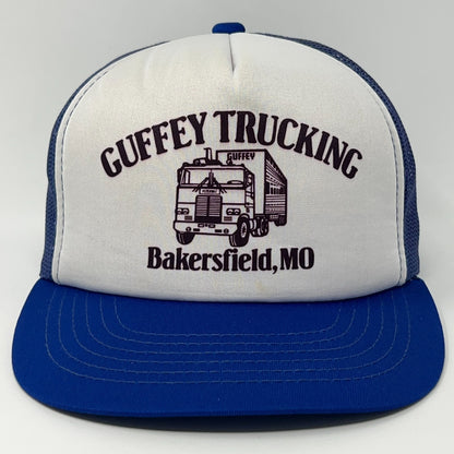 Blue and white trucker hat with Guffey Trucking logo and Missouri detail
