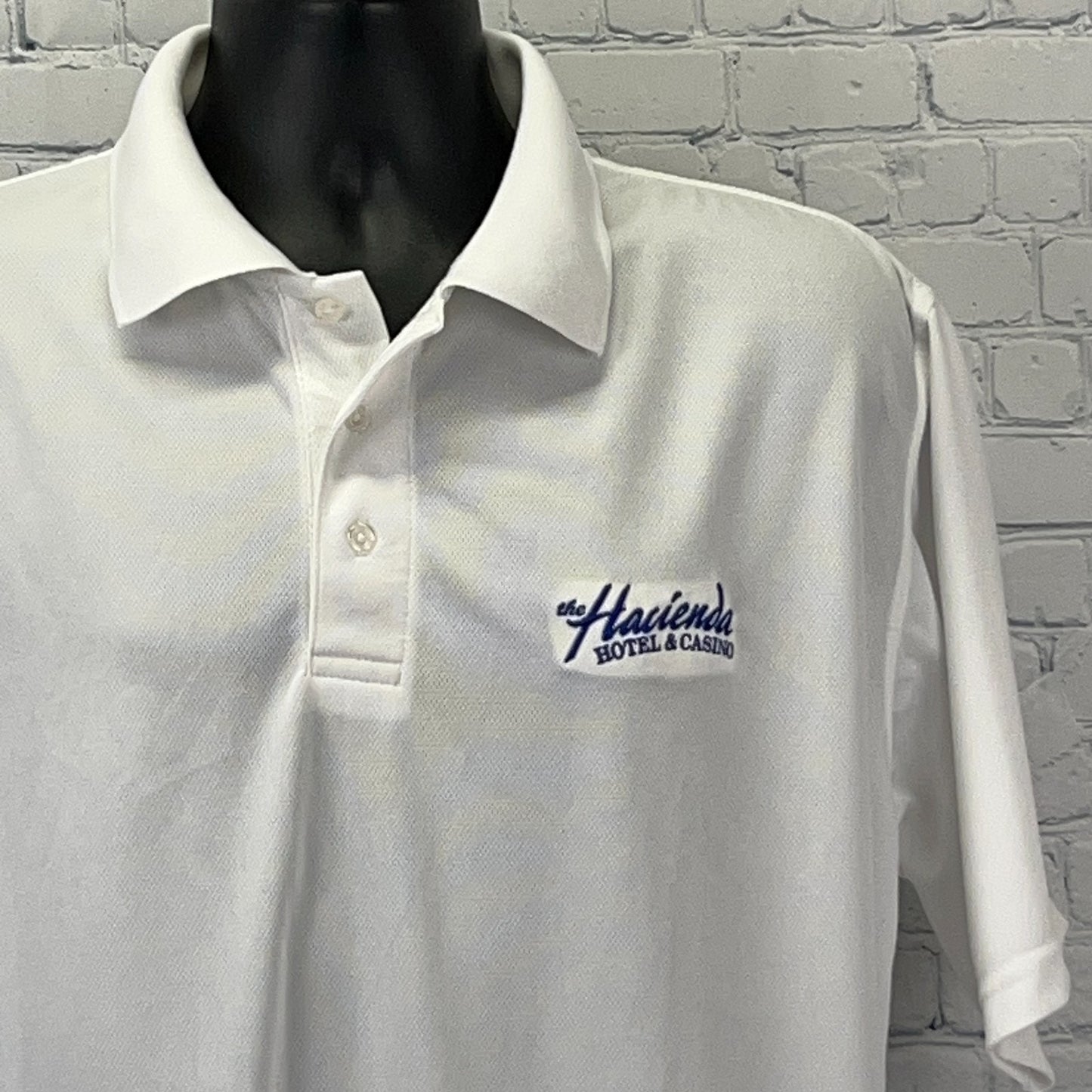 White Vintage Polo Shirt featuring Haciendas Hotel and Casino logo, perfect for Las Vegas fans