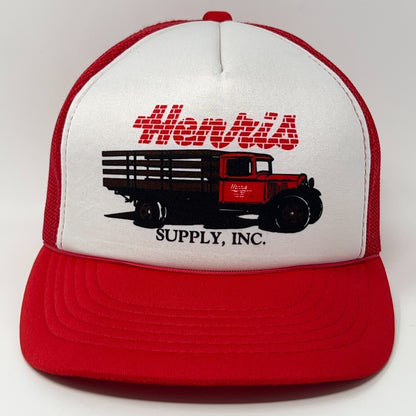Red trucker cap hat with white front panel and vintage truck logo from Hantus Supply, Inc.