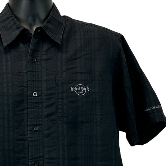 Black Hard Rock Cafe Philadelphia shirt, short sleeve with logo on chest pocket and detail view