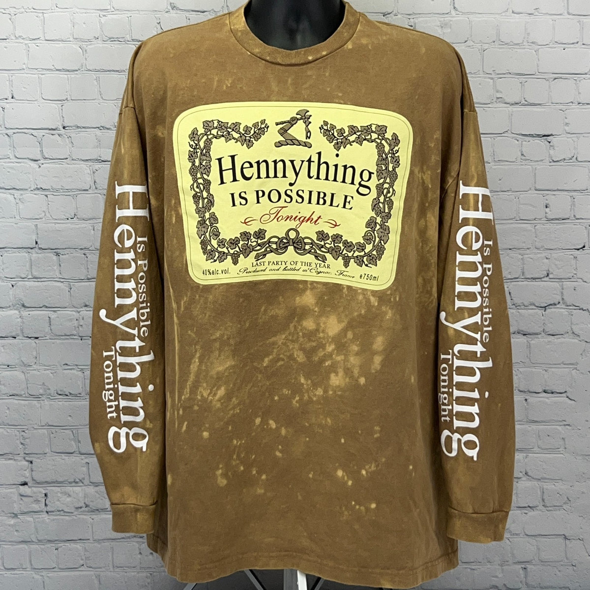 Brown long sleeve Hennessy t-shirt with front graphic and 'Hennything is Possible' text on sleeves