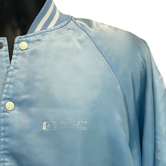Vintage light blue jacket featuring Hewlett Packard logo, front view with snap buttons and striped collar