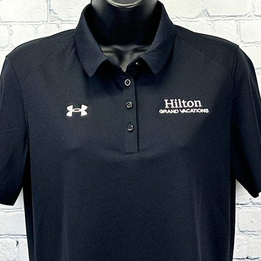 Front view of Hilton Grand Vacations Polo in navy blue with Under Armour logo on the chest