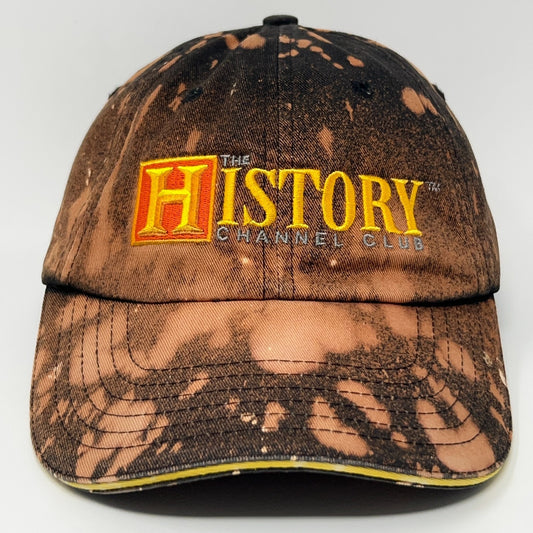 Front view of a brown distressed cap featuring the History Channel logo in vibrant colors