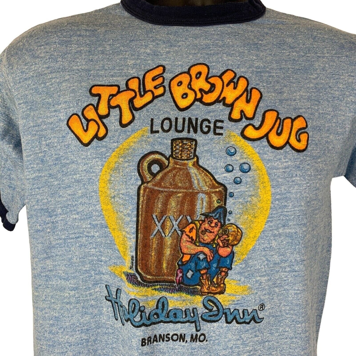 Vintage blue t-shirt featuring Little Brown Jug Lounge graphic from Holiday Inn Branson Missouri