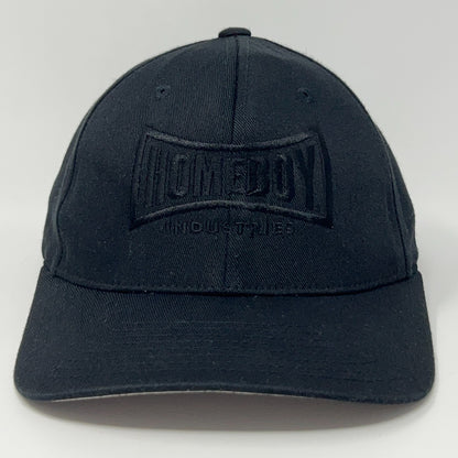 Black Flexfit cap featuring Homeboy Industries logo in front view, adjustable size for comfort