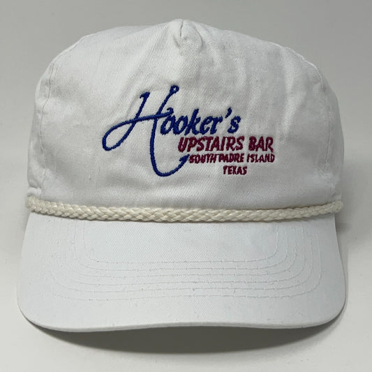 Vintage white baseball hat featuring embroidered logo for Hooker's Upstairs Bar
