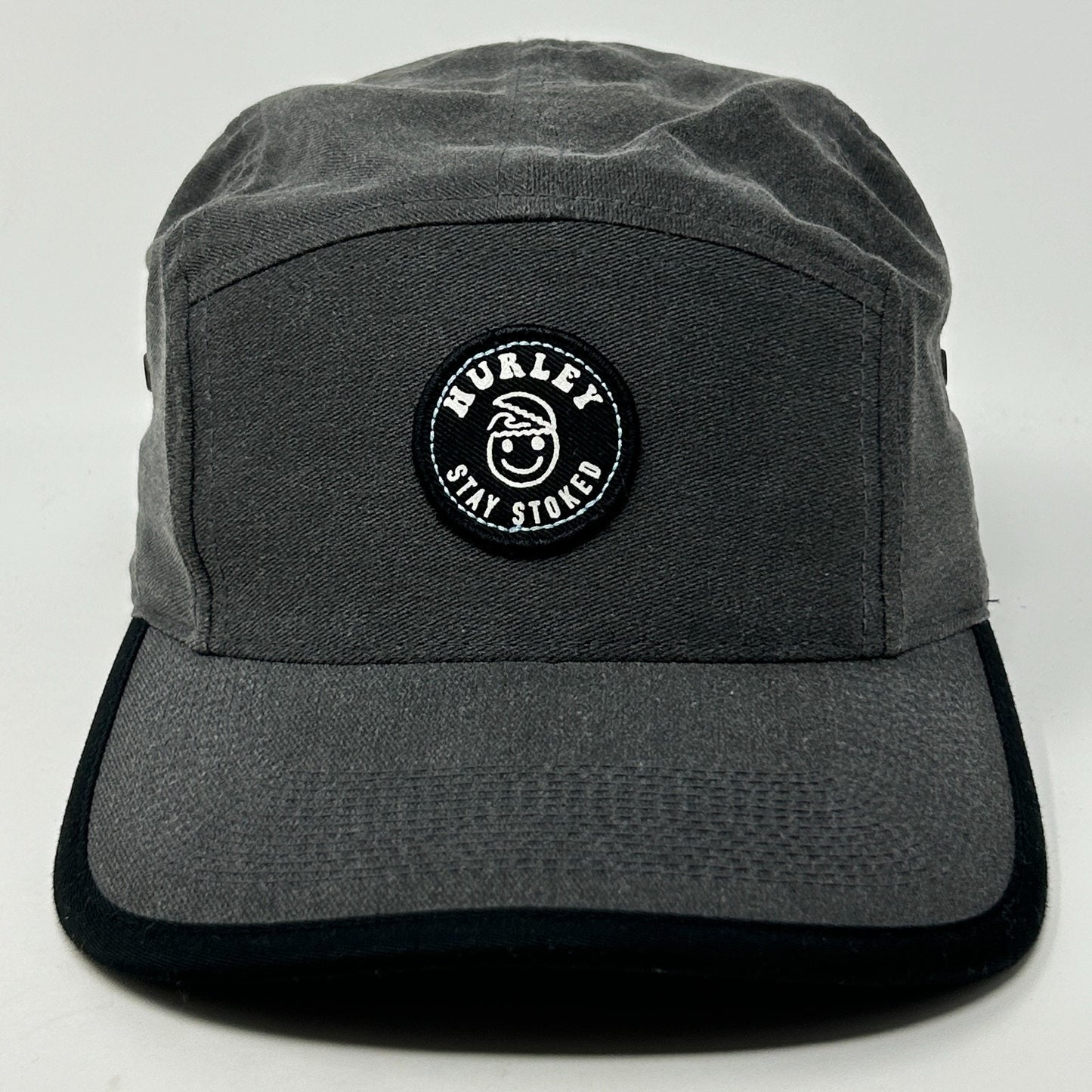 Front view of a gray Hurley Hat featuring a round logo patch with 'Stay Stoked' text.