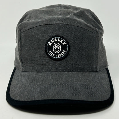 Front view of a gray Hurley Hat featuring a round logo patch with 'Stay Stoked' text.