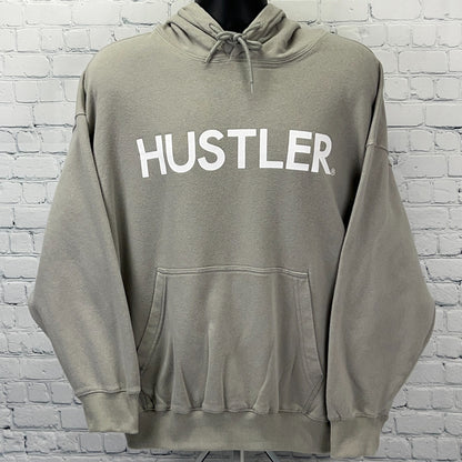 Light gray Hustler hoodie with large white logo on the front and a spacious kangaroo pocket
