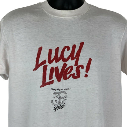 Hanes I Love Lucy T-shirt in light cream with bold red lettering and unique graphics on the front