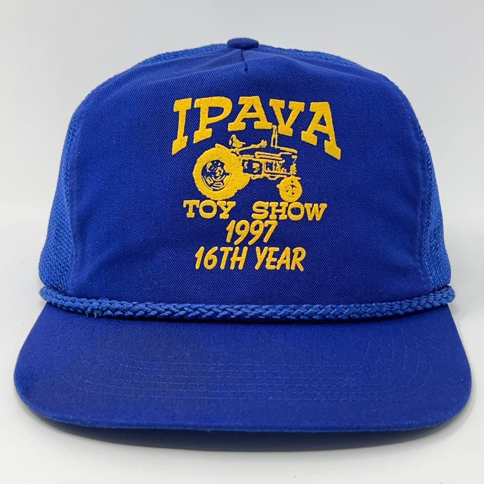 Vintage blue baseball hat with yellow IPAVA Toy Show 1997 logo and braided brim detail