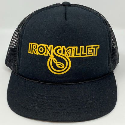 Vintage black trucker hat with yellow Iron Skillet logo on the front for casual wear