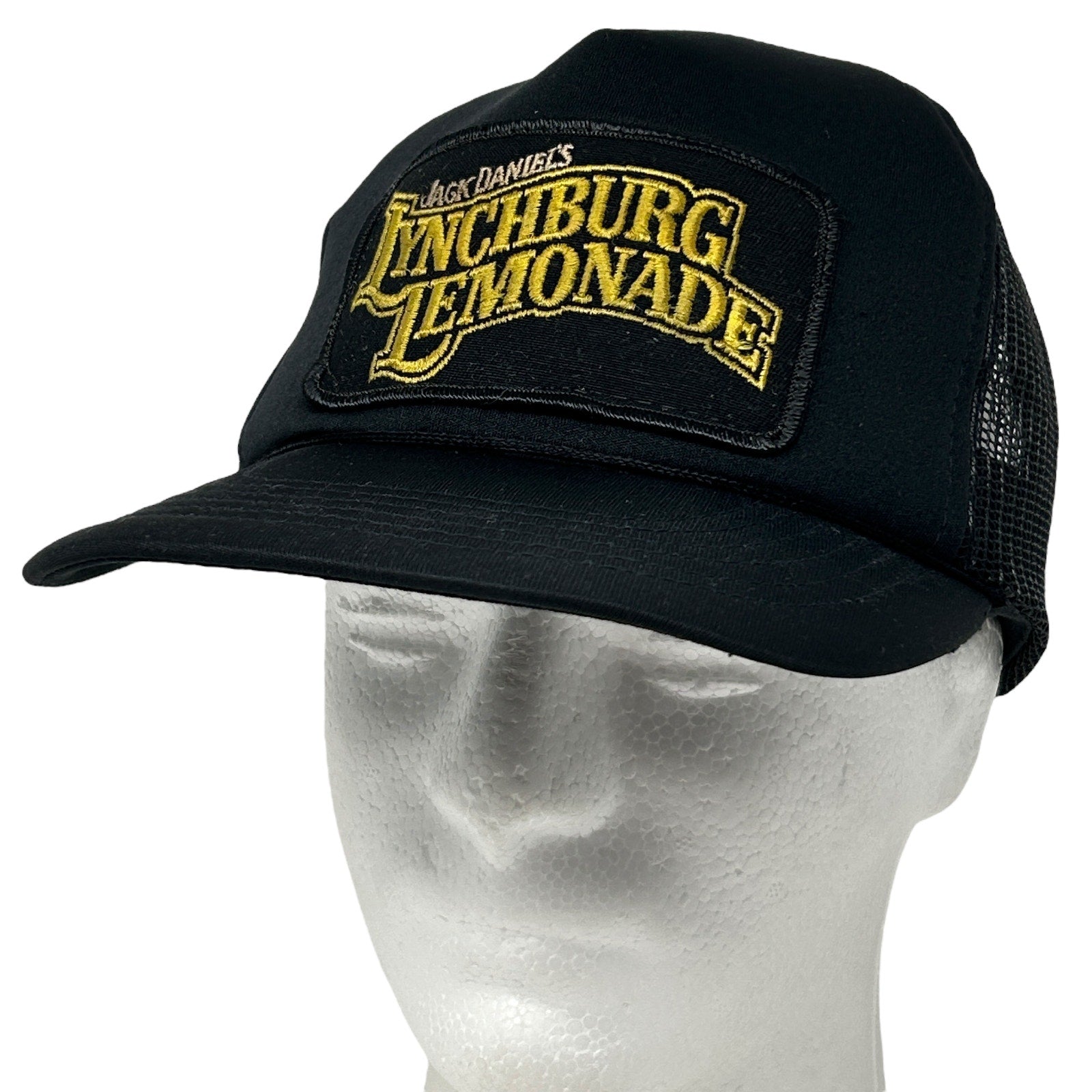 Vintage black trucker hat featuring a Jack Daniels Lynchburg Lemonade patch on the front