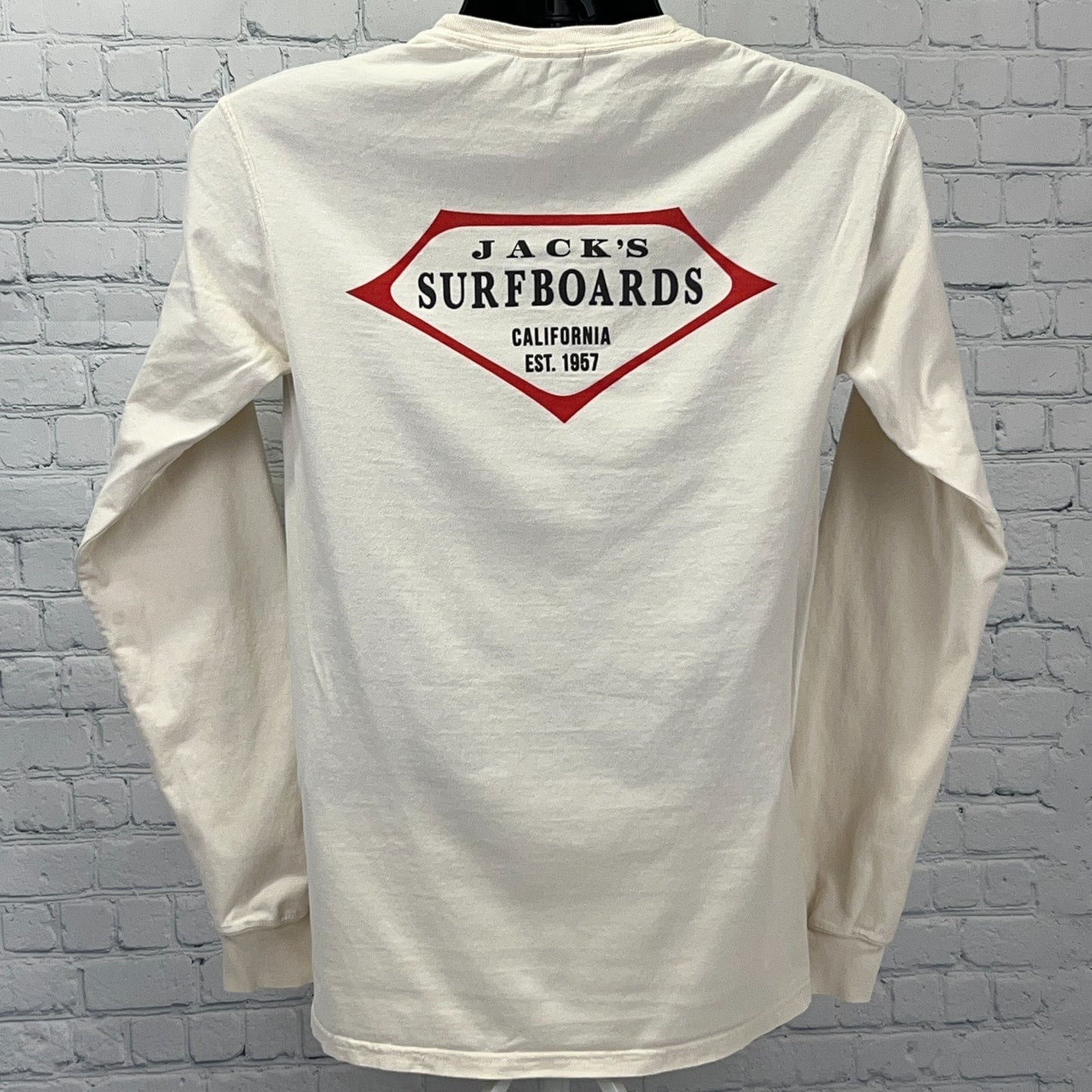 Back view of Jack's Surfboards long sleeve cream t-shirt featuring red logo and established year 1967