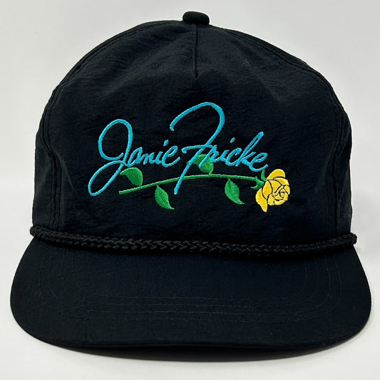 Vintage black hat featuring Janie Fricke embroidered with a yellow rose on the front