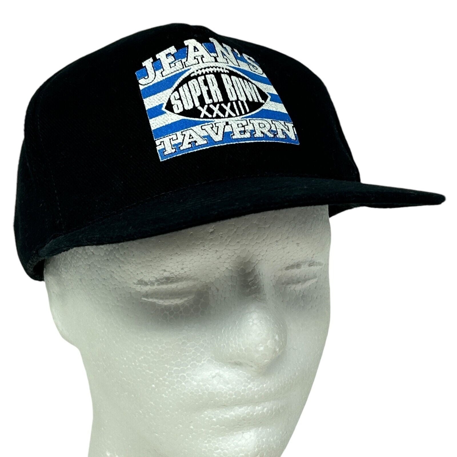 Black Otto hat featuring Denver Broncos Super Bowl XXXII logo on front in detailed view