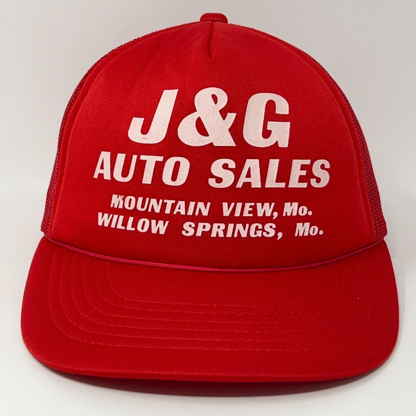 Red Vintage Trucker Hat with J&G Auto Sales logo and mesh back for breathability