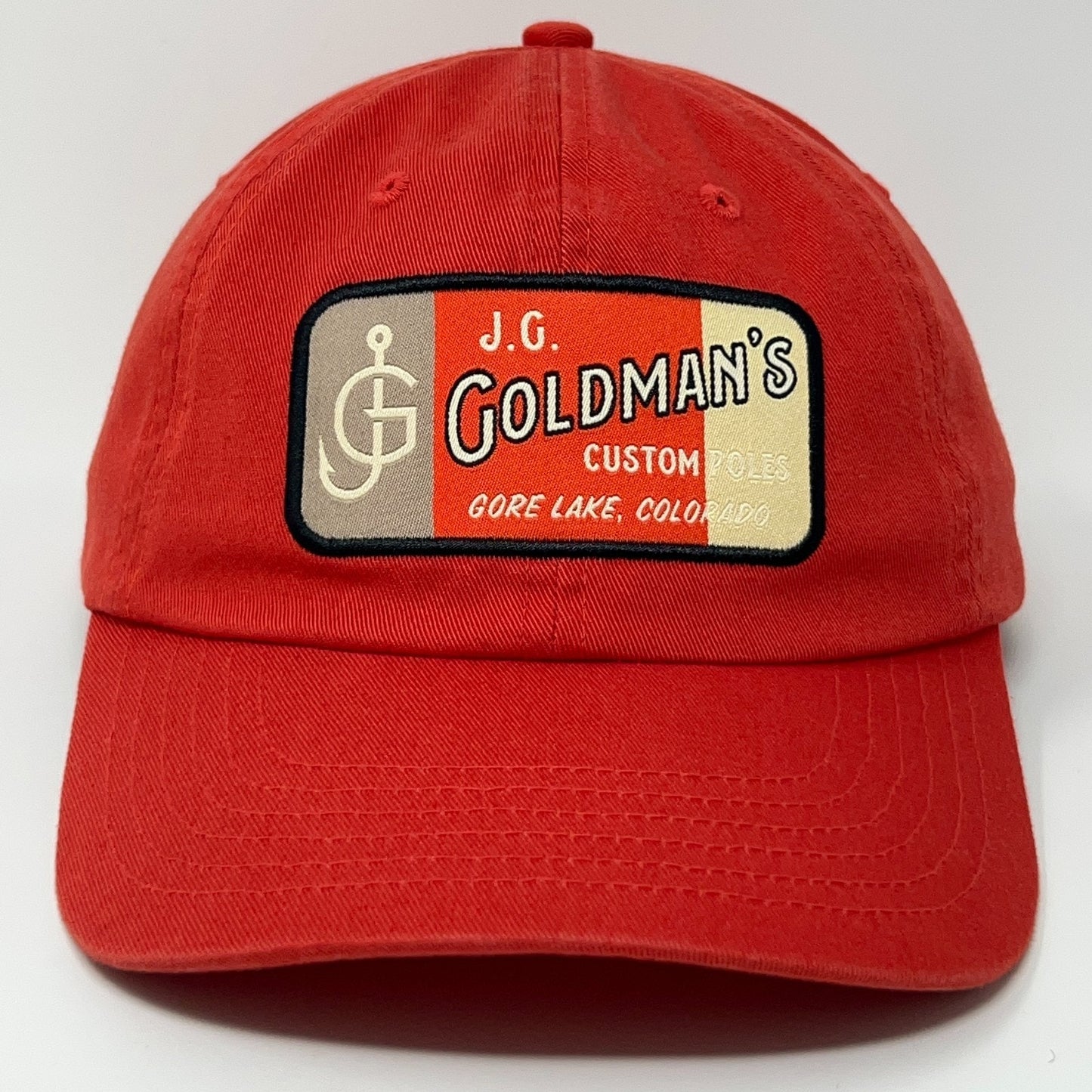 Red J.G. Goldman's cap with embroidered logo, perfect for fishing enthusiasts.