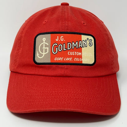 Red J.G. Goldman's cap with embroidered logo, perfect for fishing enthusiasts.