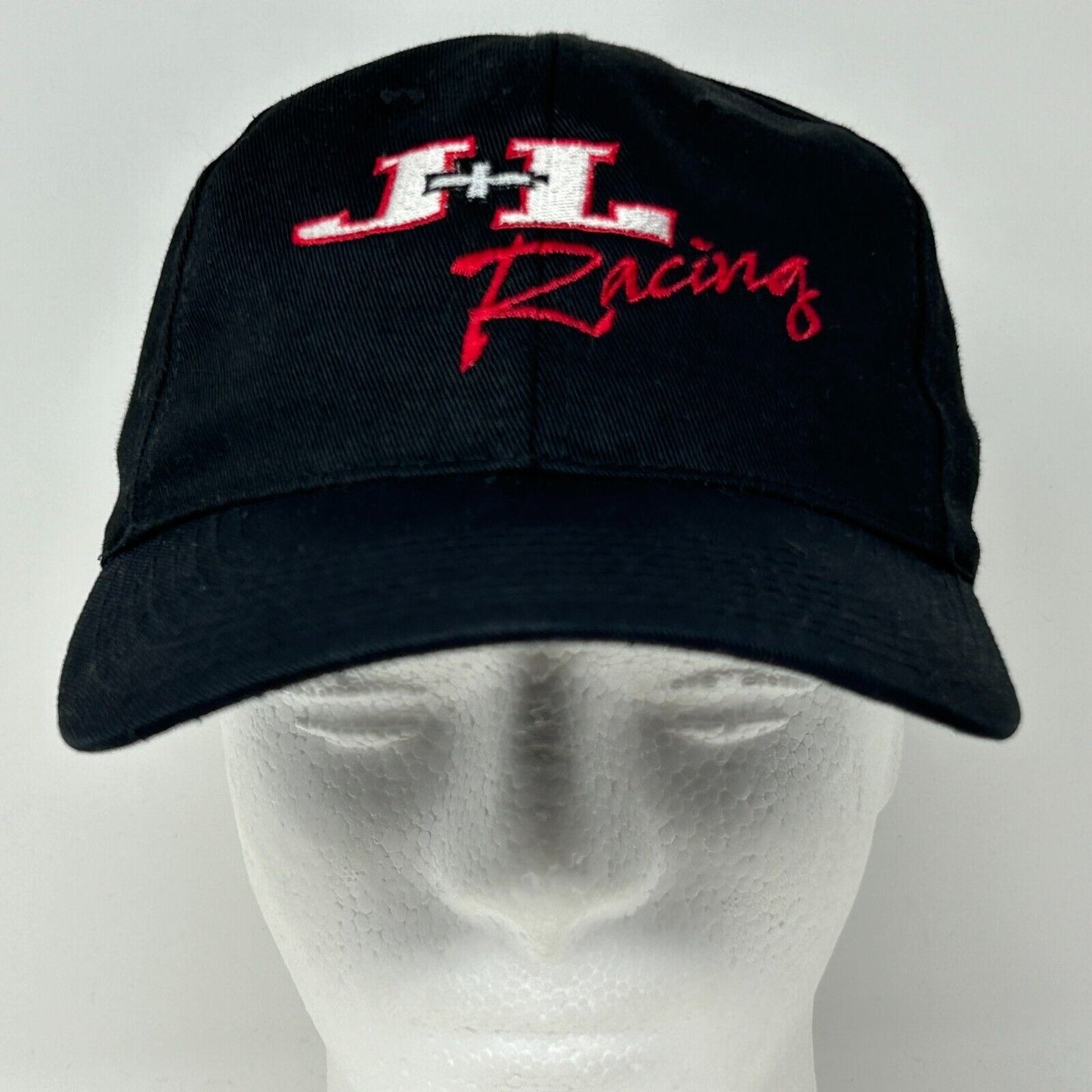 Front view of a black JL Racing cap with embroidered logo in red and white, ideal for racing enthusiasts