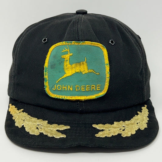John Deere black cap with a vintage logo patch and gold embroidery detailing