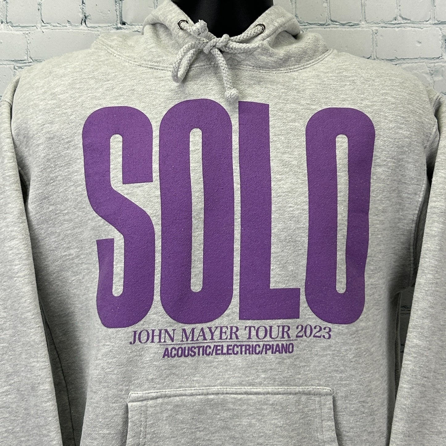Gray John Mayer Hoodie featuring purple SOLO graphic and tour details on the front