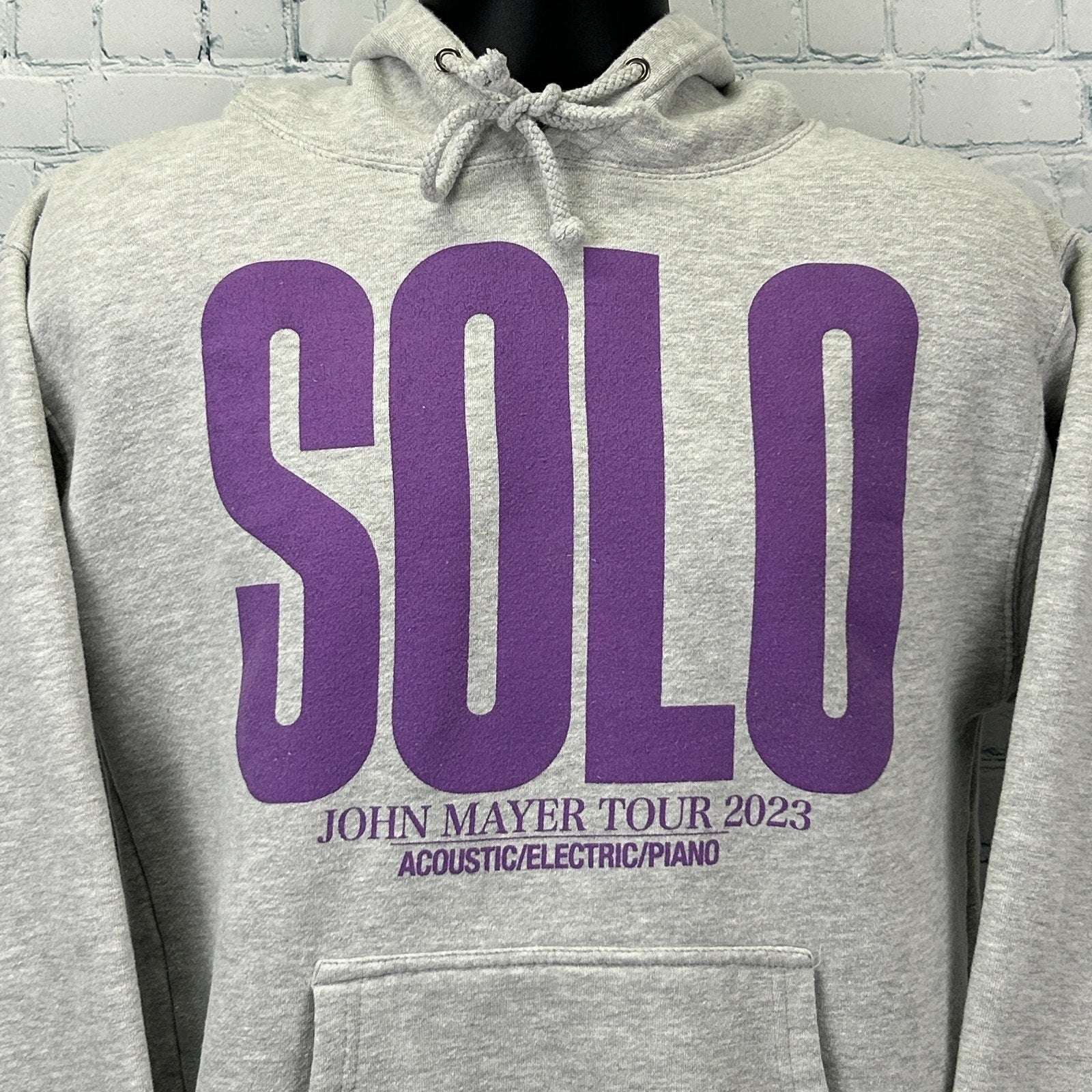Gray John Mayer Hoodie featuring purple SOLO graphic and tour details on the front