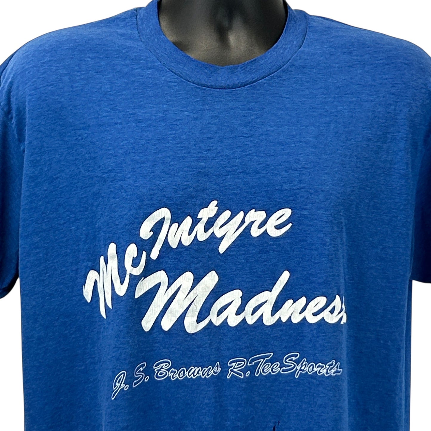 Front view of blue Stedman T-shirt featuring McIntyre Madness graphic in white font
