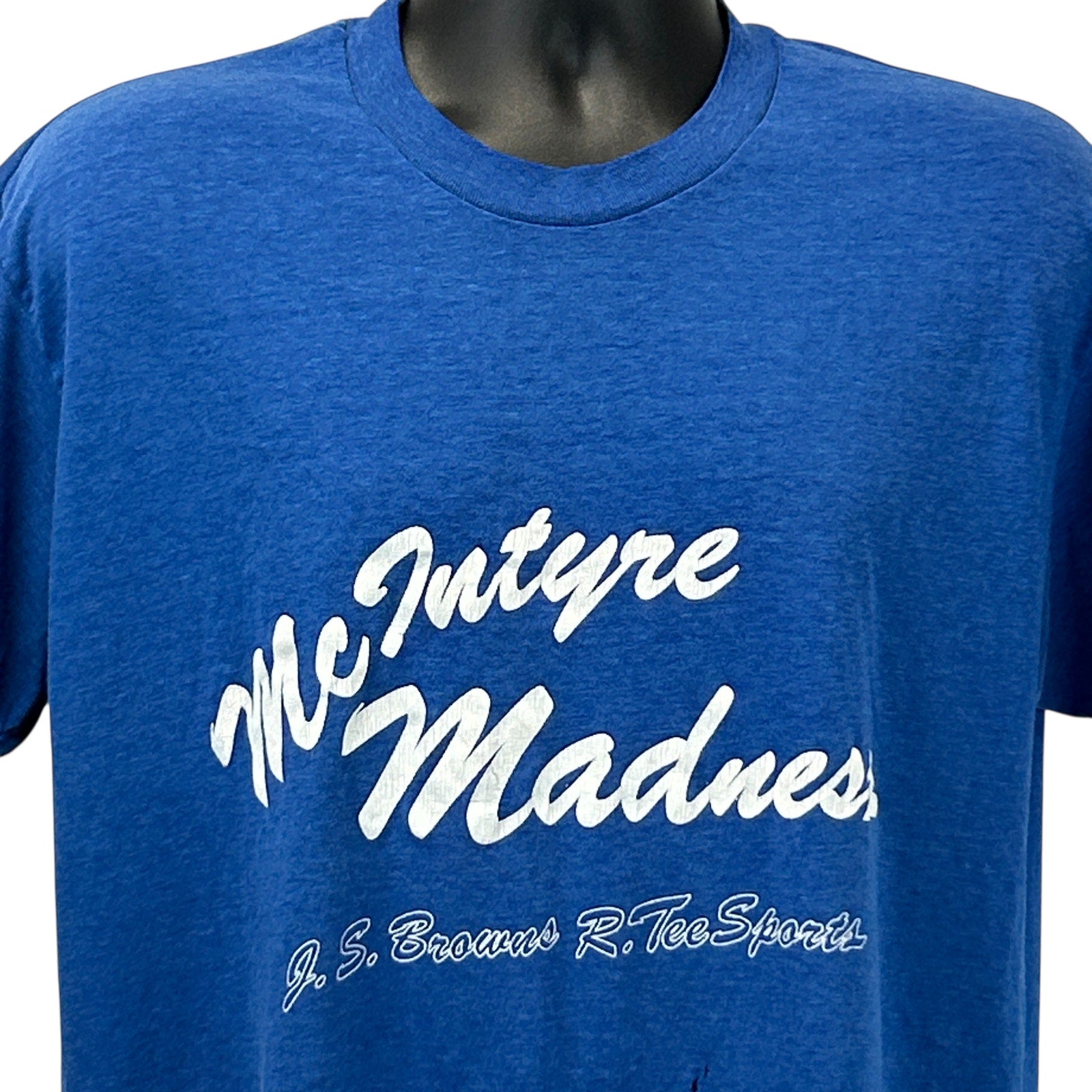 Front view of blue Stedman T-shirt featuring McIntyre Madness graphic in white font