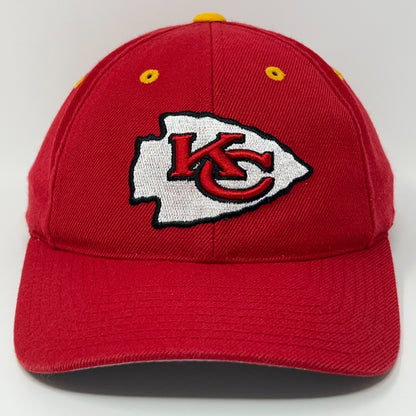 Red Kansas City Chiefs baseball cap with embroidered logo on front and yellow eyelets