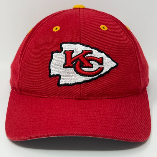 Red Kansas City Chiefs baseball cap with embroidered logo on front and yellow eyelets
