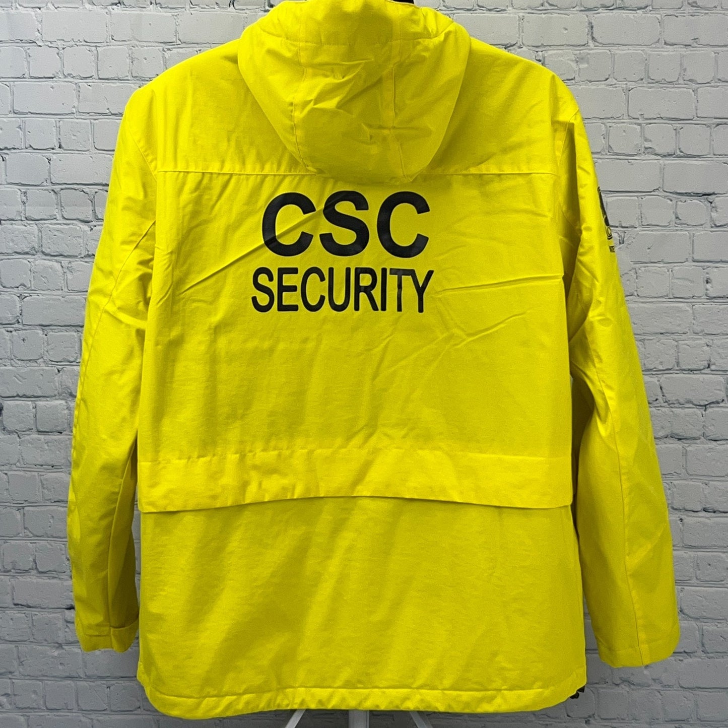NFL Kansas City Chiefs yellow jacket, back view with CSC Security printed