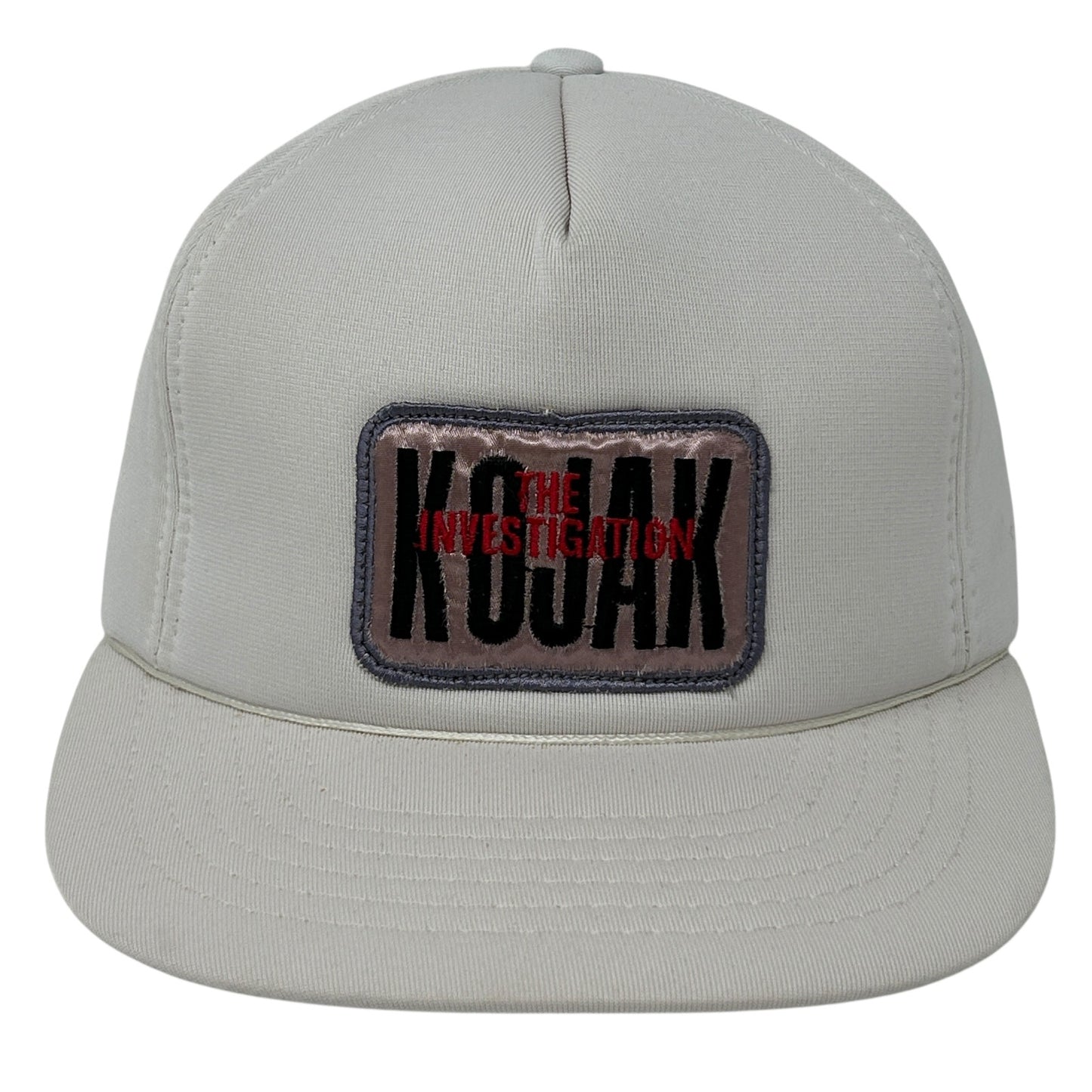 Front view of Vintage Kojak cap in light gray featuring 'THE INVESTIGATION' patch