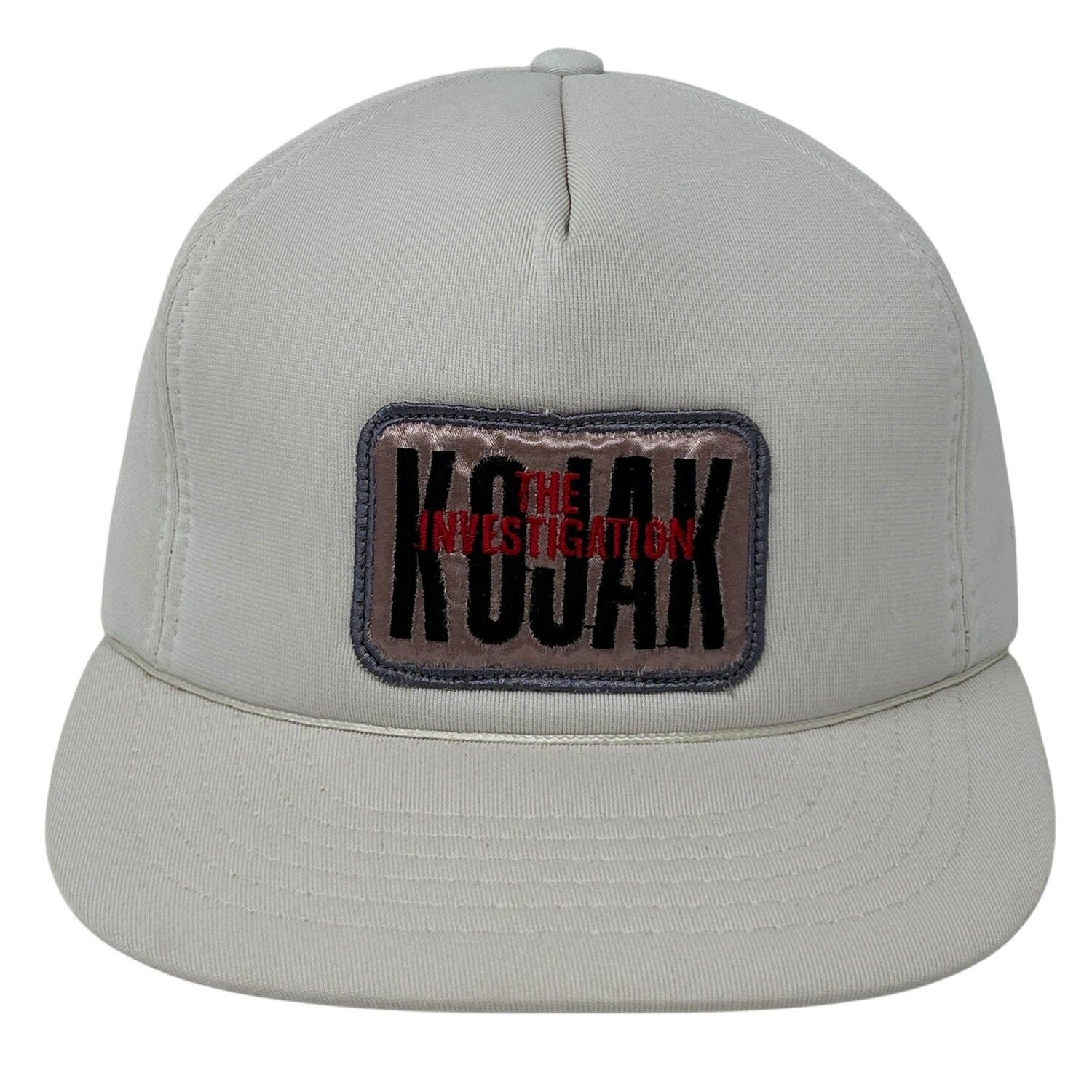 Front view of Vintage Kojak cap in light gray featuring 'THE INVESTIGATION' patch