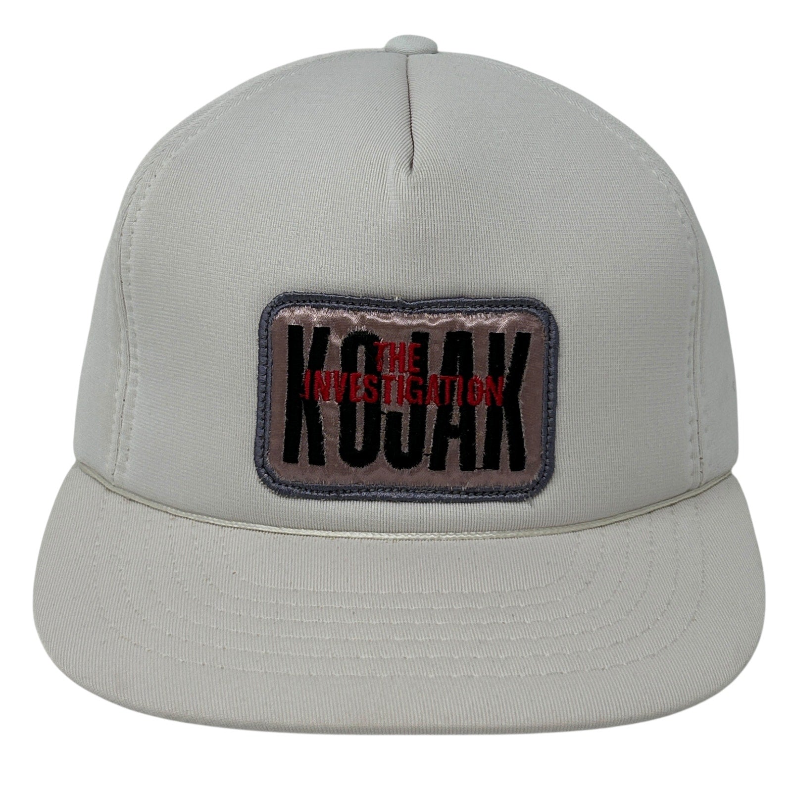 Front view of Vintage Kojak cap in light gray featuring 'THE INVESTIGATION' patch