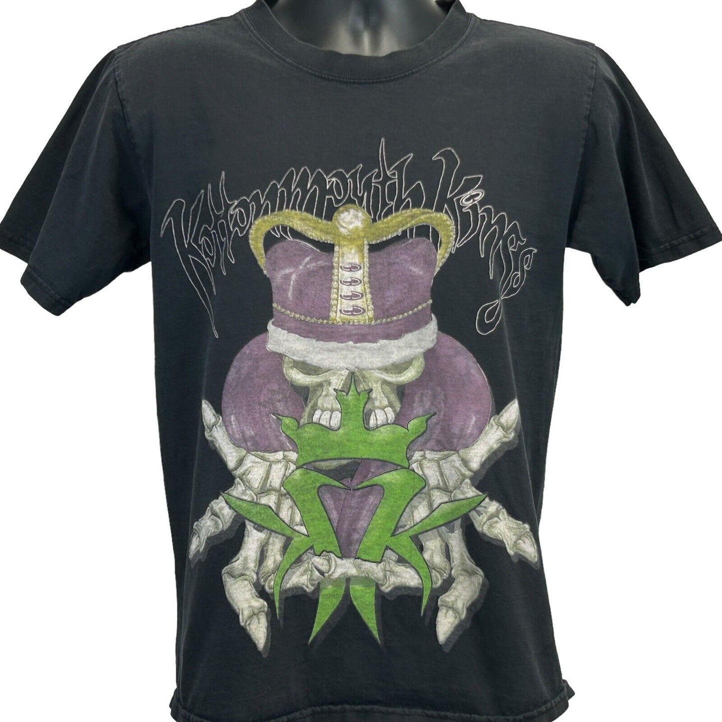 Black unbranded T-shirt featuring Kottonmouth Kings graphic design with a skull and crown, front view