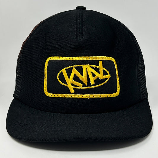 Front view of Vintage Trucker Hat Cap in black with yellow embroidered logo and mesh back