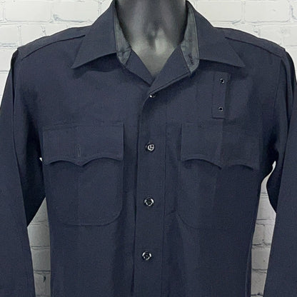 Vintage navy blue LAPD uniform shirt featuring two front pockets and a collar in a detailed front view