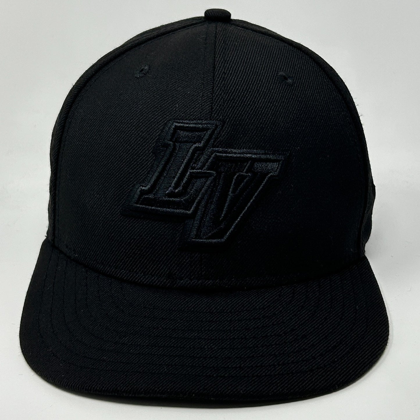 Black New Era Las Vegas Aviators Hat with raised LV logo on the front view