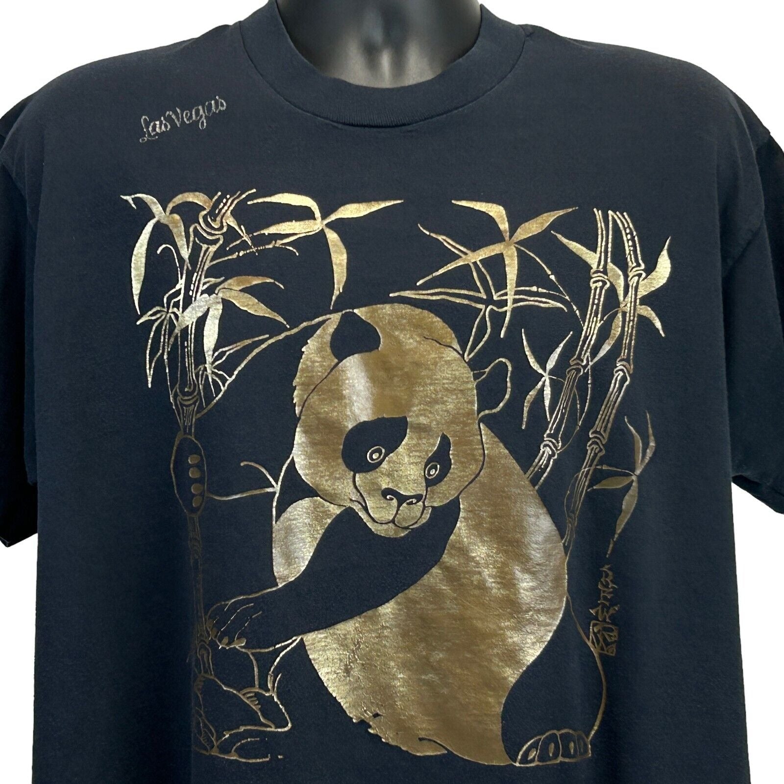 Black T-Shirt featuring a Giant Panda Bear design in gold with bamboo, front view