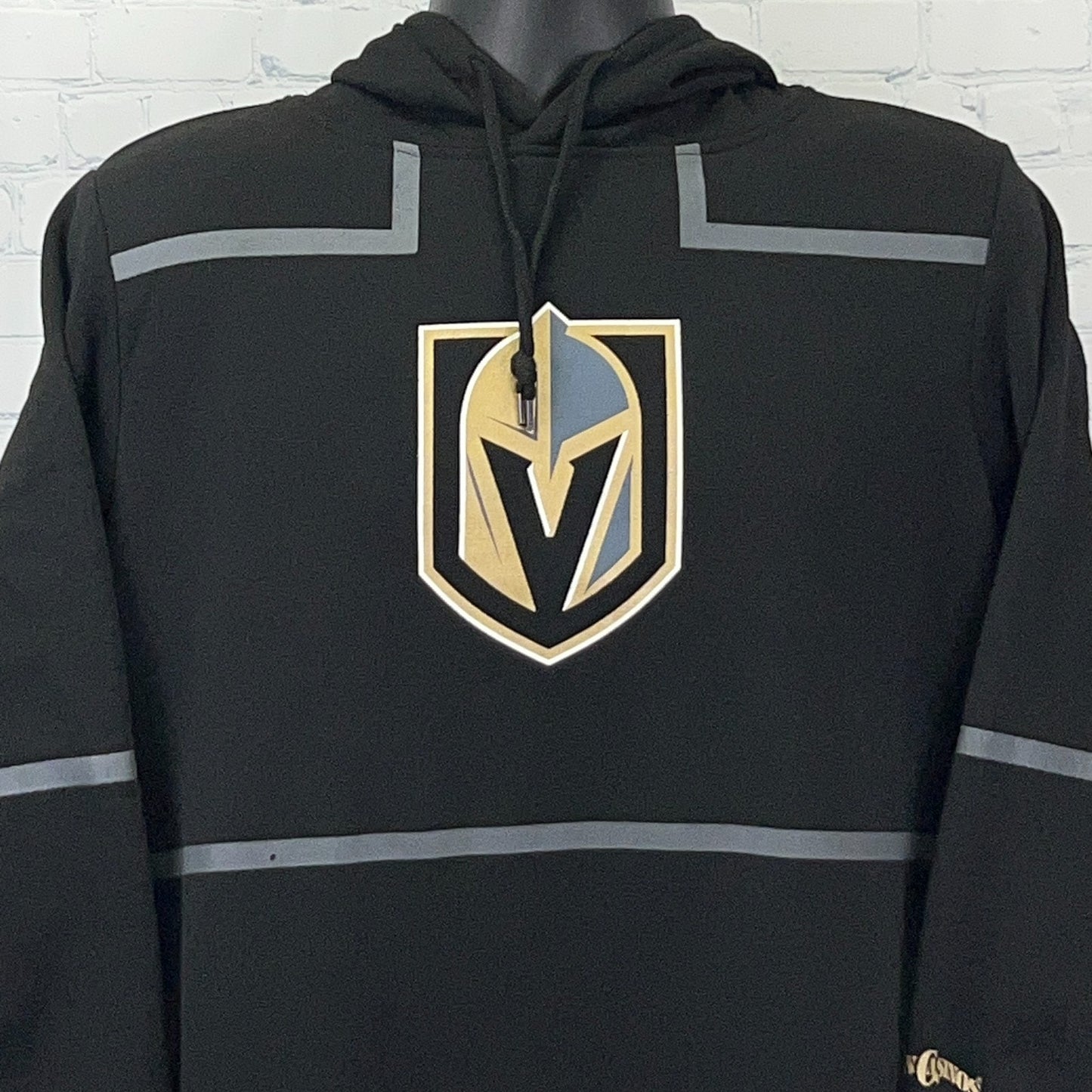 Front view of black hoodie featuring the Las Vegas Golden Knights logo in gold and silver details