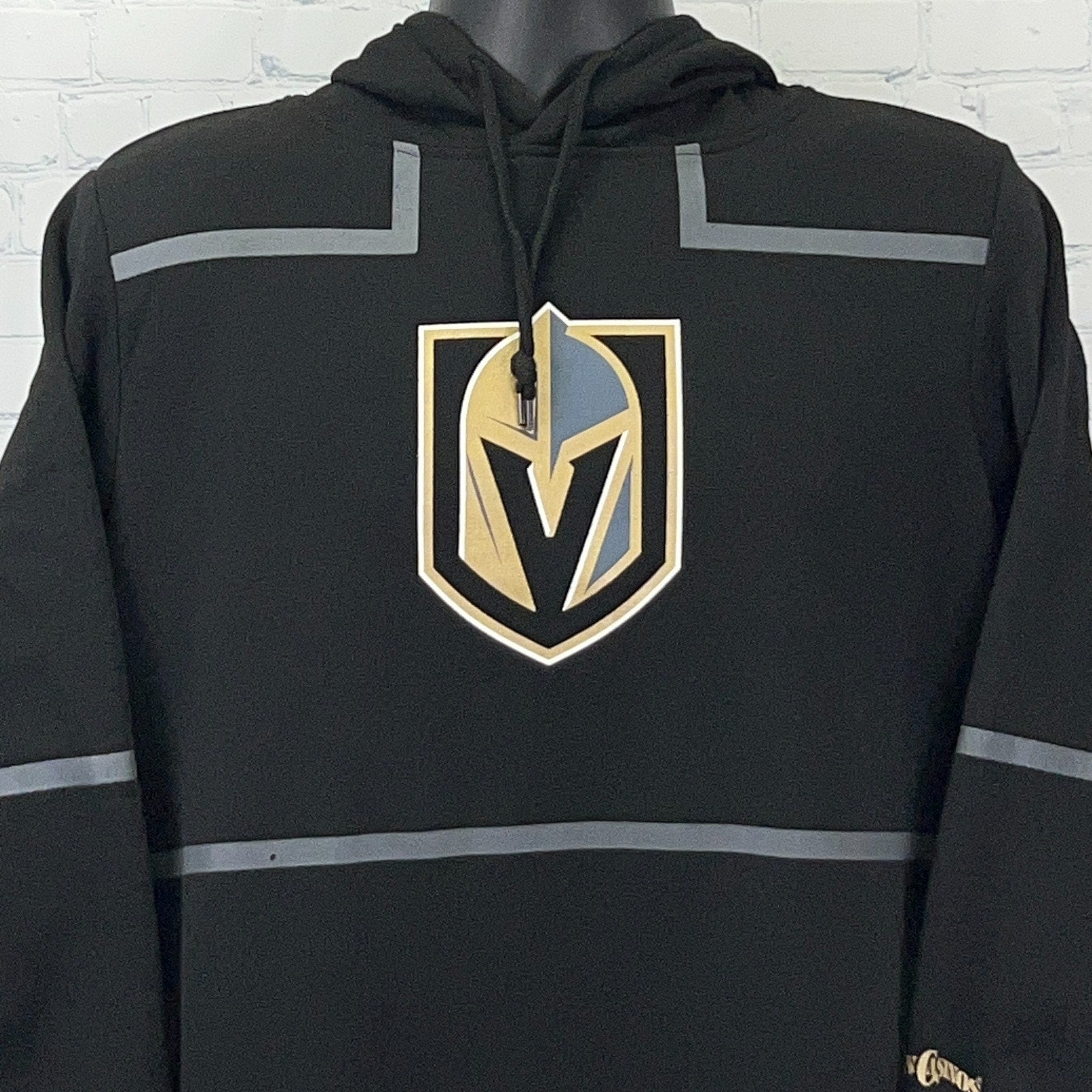 Front view of black hoodie featuring the Las Vegas Golden Knights logo in gold and silver details