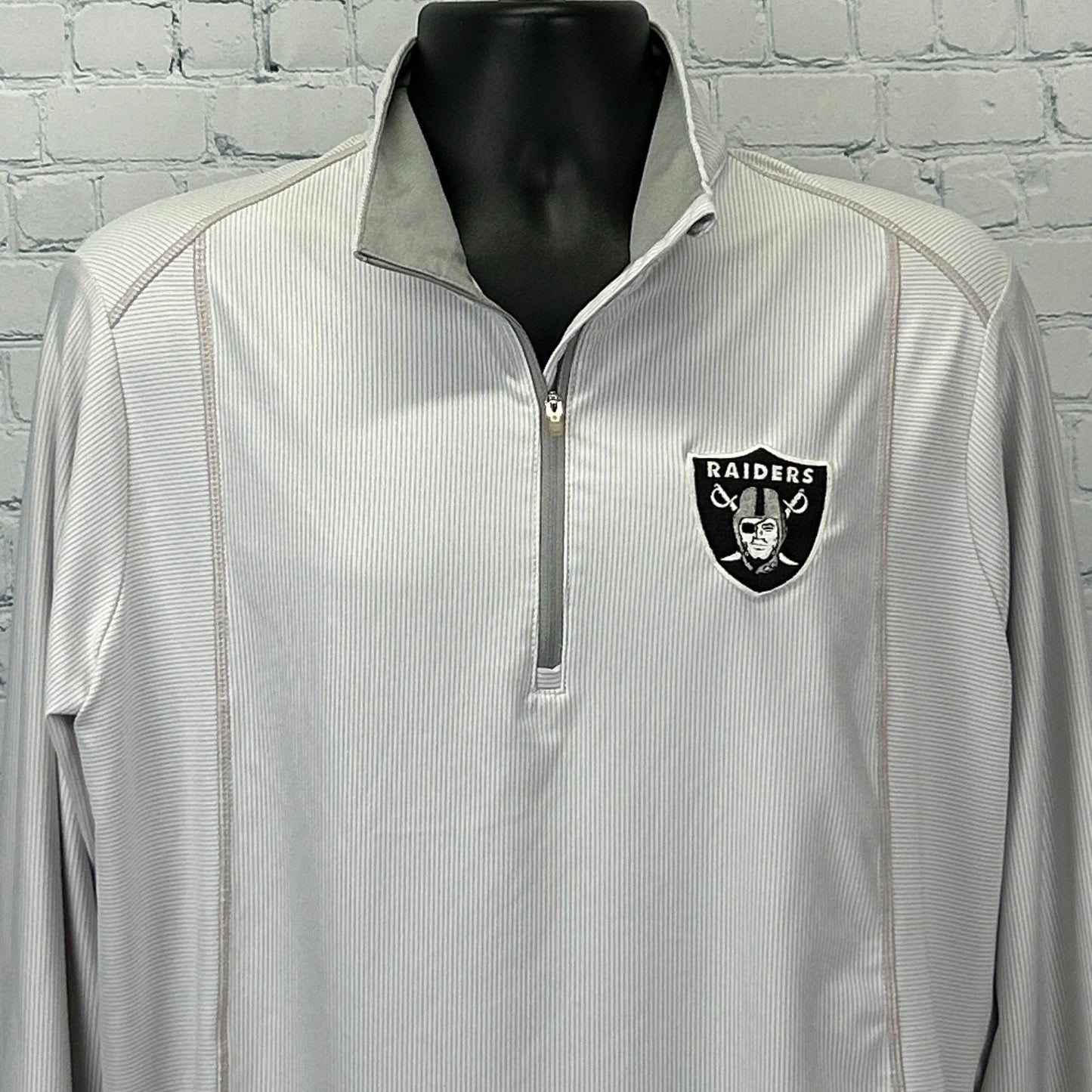 Antigua Las Vegas Raiders Shirt in light gray with quarter zip and team logo on the chest